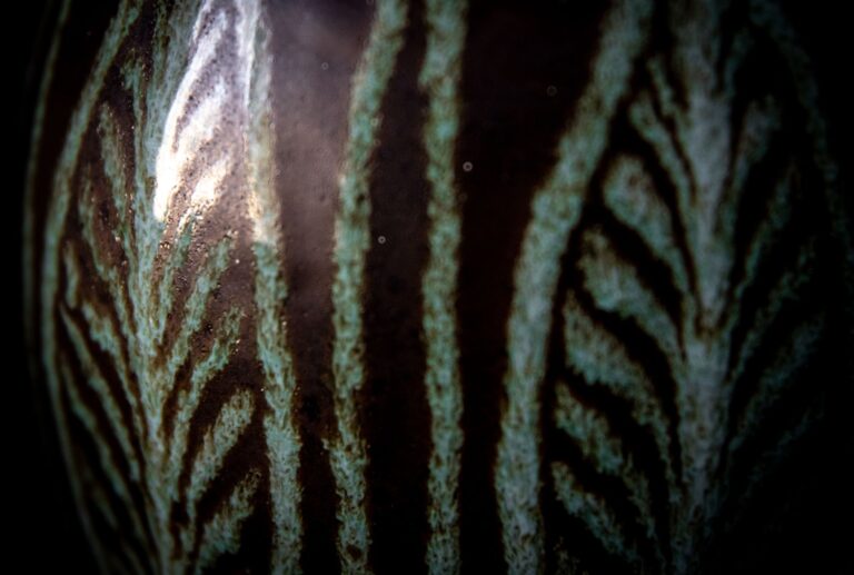 A close-up shot of a textured ceramic surface